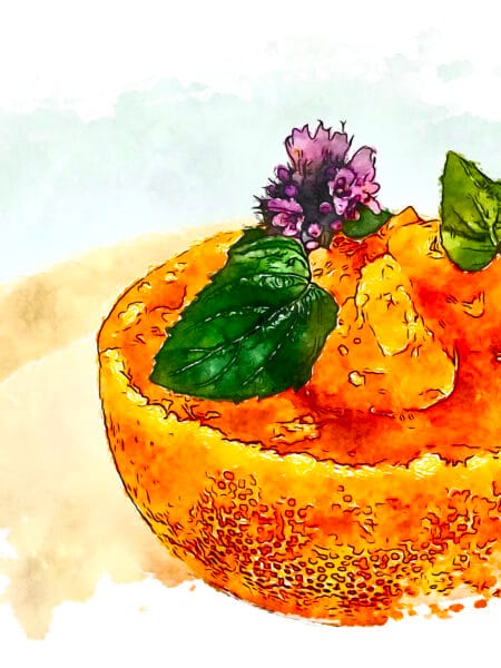 Mikan gelee garnished with mint and purple mint blossoms.