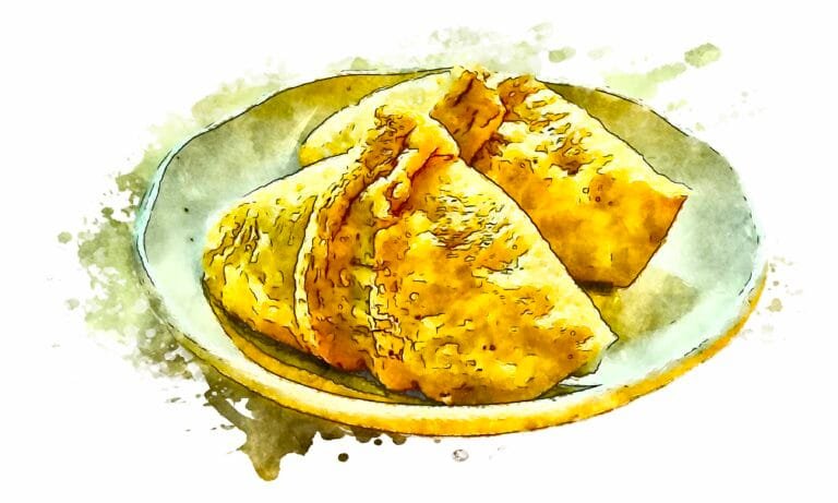 Two pieces of inari sushi filled with rice seasoned with yuzu on an off-white ceramic plate.