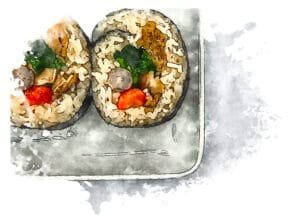 Slices of colorful vegetable futomaki (thick roll) arranged in a row.