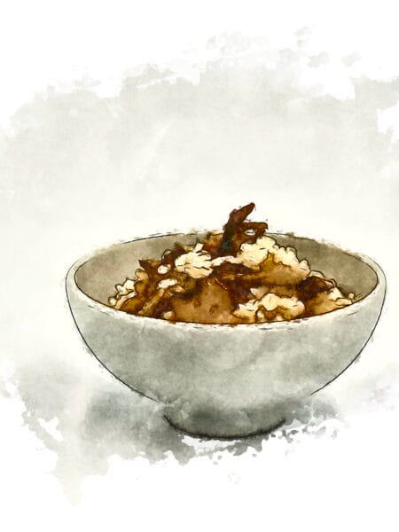 A white ceramic bowl filled with warm maitake mushroom rice.